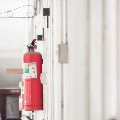 Fire Extinguishers Mounted On Wall